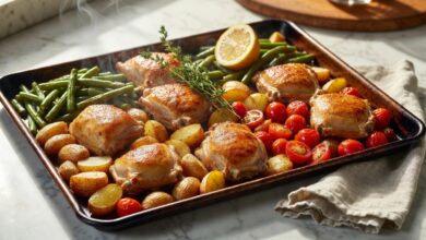 Sheet pan chicken thighs with baby potatoes, green beans, and cherry tomatoes