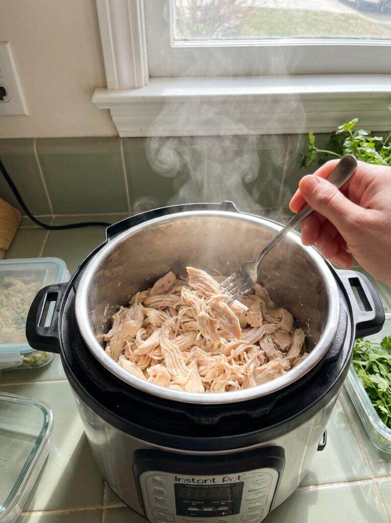 How to Cook Chicken Breast So It's Never Dry Again: Every Method Compared 9 How to Cook Chicken Breast So It's Never Dry Again: Every Method Compared Shredded chicken breast being pulled apart with two forks inside an Instant Pot
